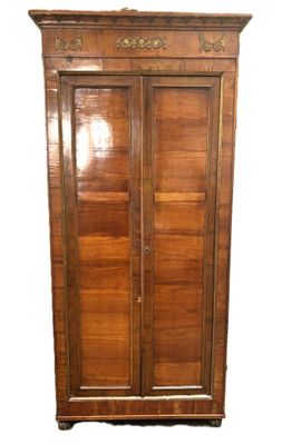 an image of a wooden armoire with a mirror on top of it