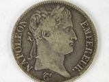 a close up of a coin with a woman ' s face on it
