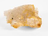 un gros plan d'un morceau de quartz jaune sur une surface blanche