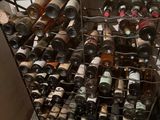 many bottles of wine in a wine rack in the kitchen