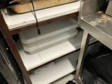 a large pan of food sitting on a shelf in a kitchen