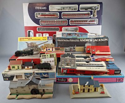a lot of toy trains on display in a display case