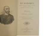 an old book with a picture of a man in a suit and tie