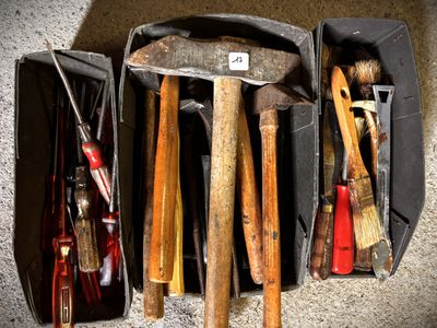 a lot of tools in a case on the floor