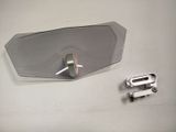 a mirror that is sitting on a table next to a couple of clips