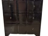 an image of a black chest of drawers on a white background