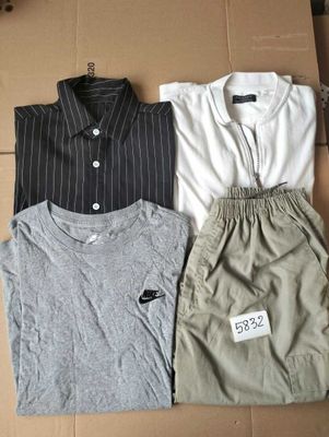 three men ' s shirts in a box with a price tag on them