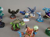 many figurines of different types and sizes on the table