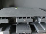 a picture of a stack of plastic boxes on a wooden table