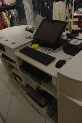 a computer desk with a keyboard and mouse on it