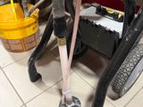 a small machine that has a hose attached to it