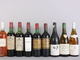 several bottles of wine are lined up in a row on a table