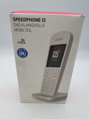 boîte contenant un téléphone portable blanc et rouge, posée sur une surface blanche