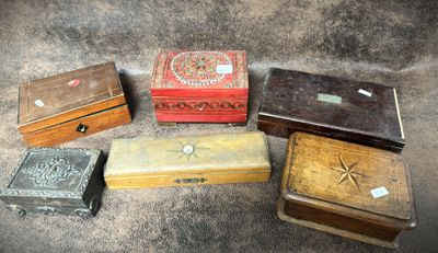 several small wooden boxes are lined up on the floor