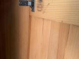 a close up of a wooden cabinet with a latch on it