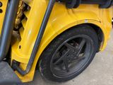 a close up of a yellow school bus with its door open
