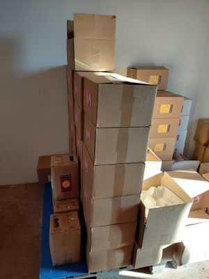 a stack of boxes sitting on top of a blue carton