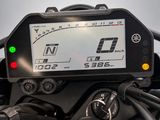 a close up of a motorcycle with a speedometer on it