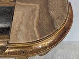 a table with a marble top and a wooden base