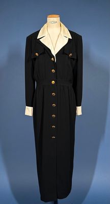 an image of a black and white coat and dress on a mannequin