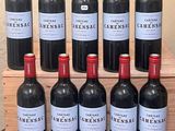 several bottles of wine sitting on top of a wooden crate