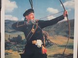a poster of a man in uniform holding a bow and arrow