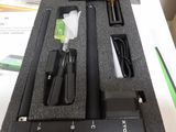 a black box with a pen and a charger inside of it