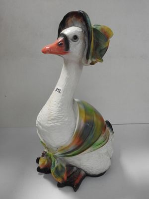 a white duck with a colorful hat on it ' s head