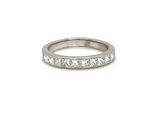 a white gold wedding band with princess cut diamonds