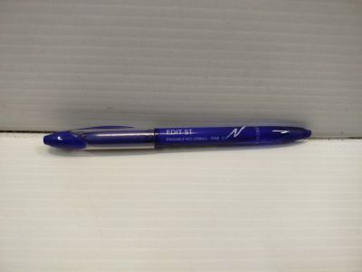 a blue pen sitting on top of a white box