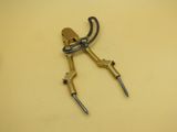 a close up of a pair of scissors on a yellow surface