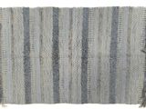 a close up of a blue and white rug with fringes