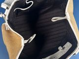 the inside of a purse with two handles and a zipper
