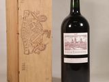 a bottle of wine sitting next to a wooden box