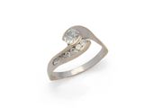 a close up of a diamond ring on a white background