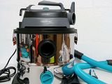 a vacuum that is sitting on a table next to a blow dryer