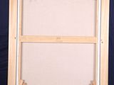 an easel with an empty canvas on it against a blue background