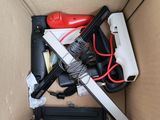 a cardboard box with a bunch of tools inside of it