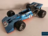 a model of a racing car on a white surface