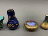 three vases are sitting next to each other on a table