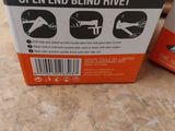 two boxes of wokin open end blind rivets on a table