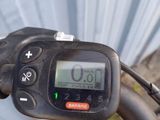 a close up of a bicycle handlebar with a clock on it