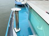 a boat that is parked on the side of the water