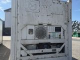 a white box with graffiti on it sitting in a parking lot
