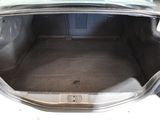 a trunk of a car that is empty with the door open
