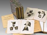 several books with pictures of hats and hats on them sitting on top of each other