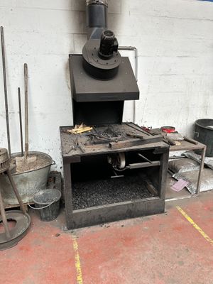 a stove that is sitting in the corner of a room