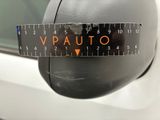 a close up of a car ' s rear view mirror with a measuring tape on it