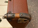 a close up of a piece of luggage that is sitting on the ground