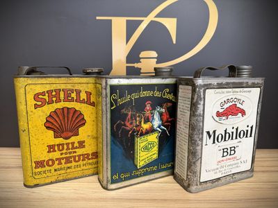 three tins that are sitting on a table